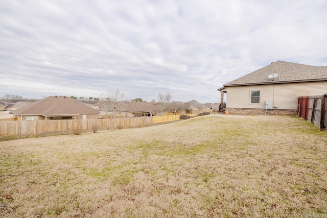 view of yard featuring a fenced backyard