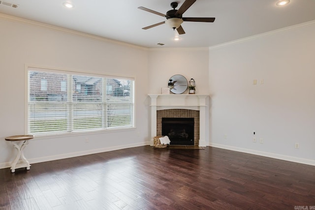 unfurnished living room featuring ornamental molding, wood finished floors, and baseboards