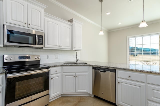 kitchen featuring stainless steel appliances, tasteful backsplash, a sink, and crown molding