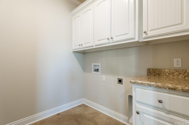 laundry area featuring cabinet space, hookup for a washing machine, electric dryer hookup, and baseboards