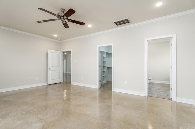 unfurnished bedroom featuring recessed lighting, a walk in closet, visible vents, and baseboards