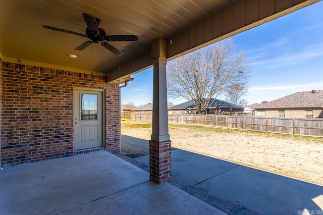 view of patio / terrace featuring ceiling fan and fence