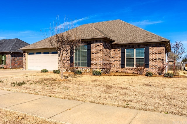 ranch-style house with a garage, concrete driveway, brick siding, and a shingled roof