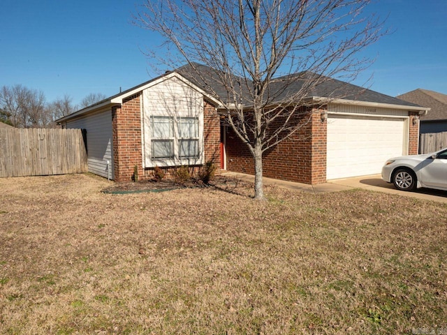 ranch-style home featuring an attached garage, fence, a front lawn, and brick siding