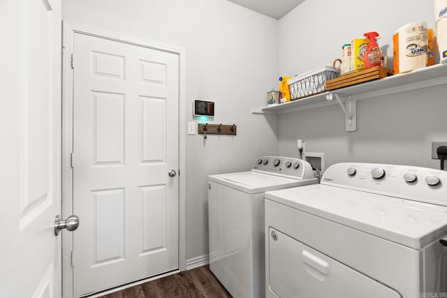 laundry area with laundry area, dark wood-type flooring, and washing machine and dryer