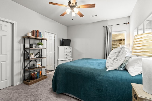 bedroom with ceiling fan, carpet flooring, and visible vents