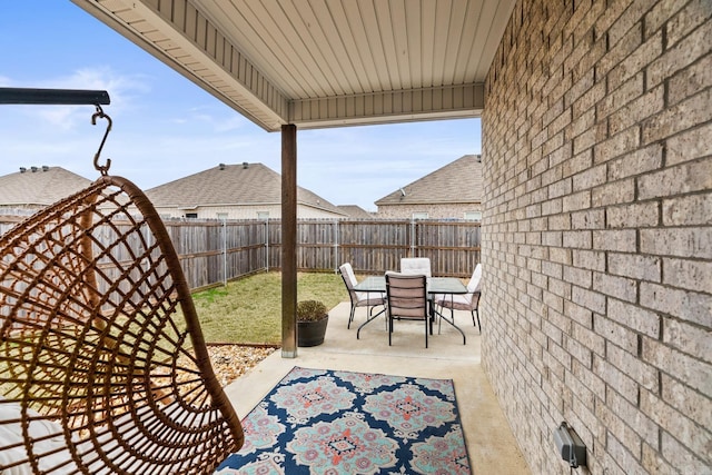 view of patio featuring outdoor dining space and a fenced backyard