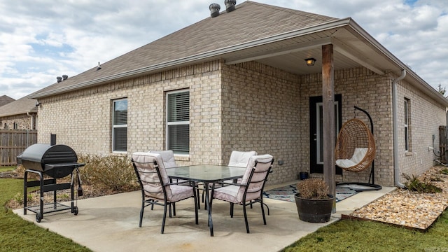 view of patio / terrace with area for grilling and fence