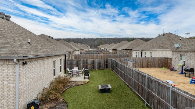 view of yard featuring a patio and a fenced backyard