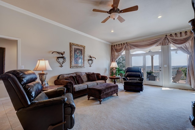 living area with light colored carpet, ceiling fan, ornamental molding, light tile patterned flooring, and recessed lighting