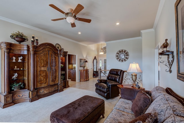 living room featuring light carpet, ceiling fan, and crown molding