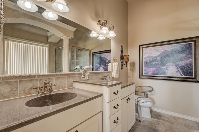 full bathroom with toilet, two vanities, a sink, a shower stall, and tile patterned floors