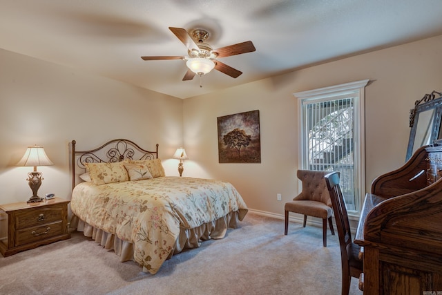 bedroom with light carpet, baseboards, and a ceiling fan