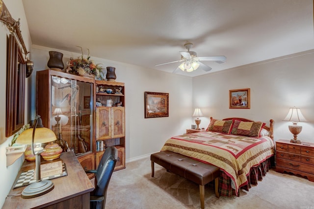 bedroom with ceiling fan, baseboards, and light colored carpet