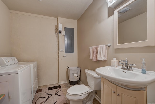 bathroom with electric panel, visible vents, toilet, vanity, and washing machine and dryer