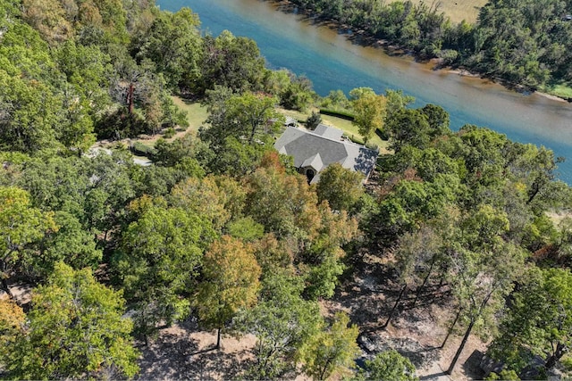 aerial view featuring a forest view and a water view