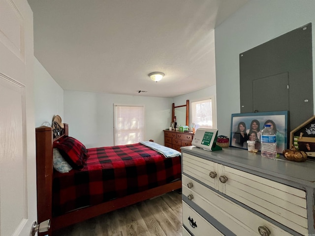 bedroom with visible vents and light wood finished floors