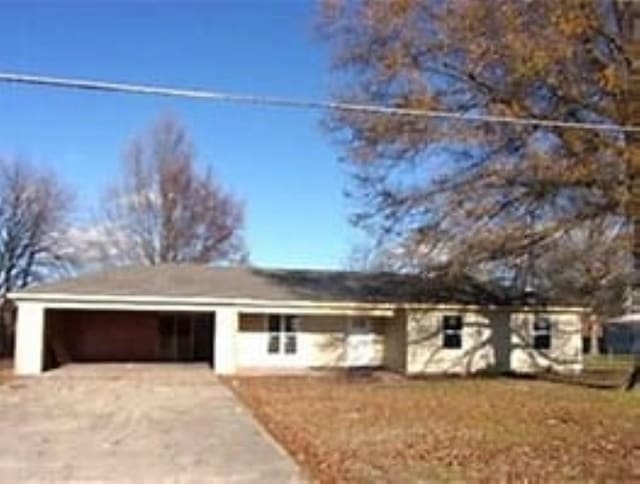 single story home featuring driveway and an attached garage