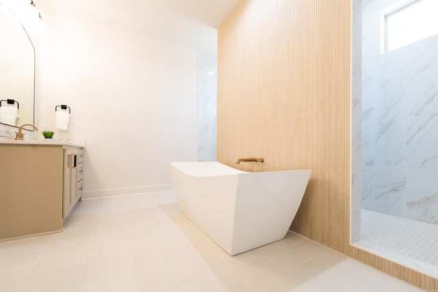 full bath featuring a soaking tub, tile patterned floors, a walk in shower, and vanity