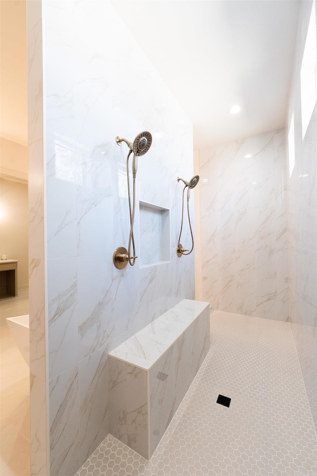 full bathroom featuring a marble finish shower