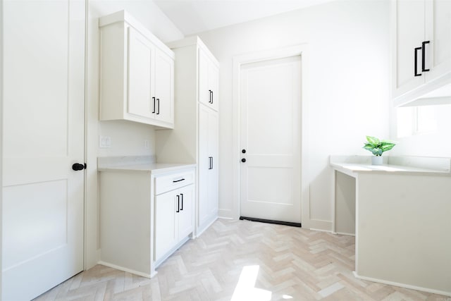 washroom featuring baseboards