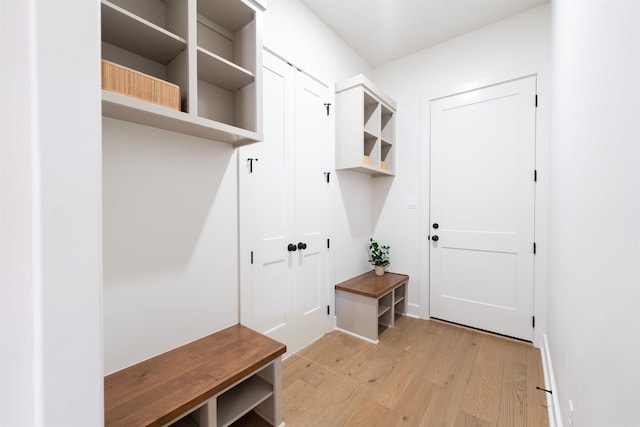 mudroom with light wood-style flooring