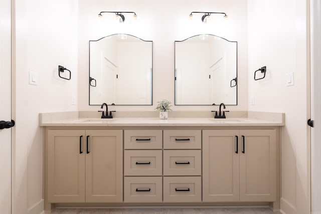 bathroom featuring double vanity and a sink