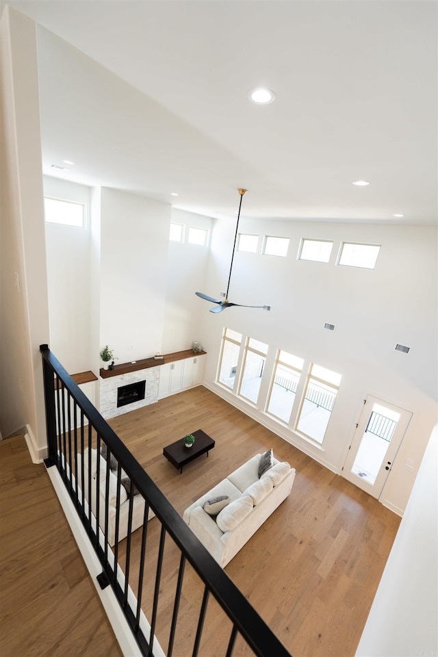 interior space featuring baseboards, wood finished floors, and recessed lighting