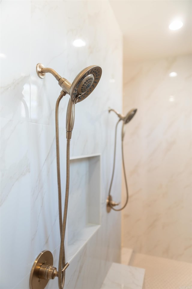 details featuring a marble finish shower