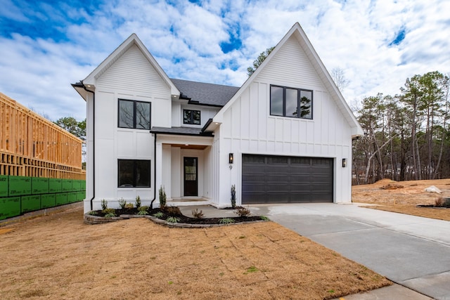 modern farmhouse style home with an attached garage, fence, concrete driveway, roof with shingles, and board and batten siding