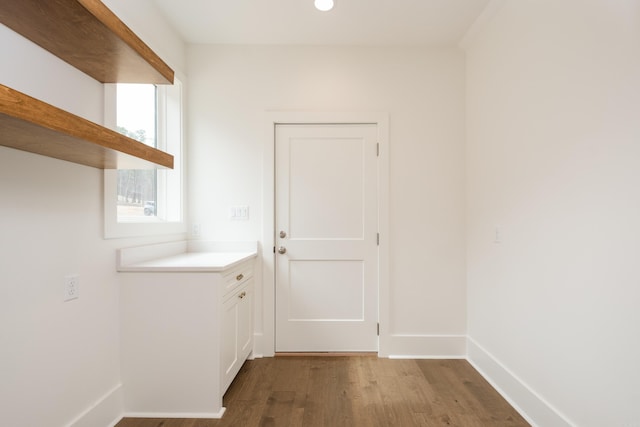 entryway featuring wood finished floors and baseboards