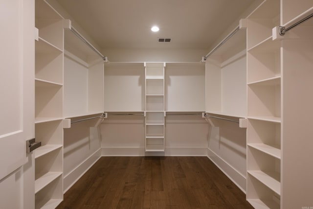 walk in closet featuring dark wood-style floors and visible vents