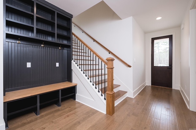 interior space featuring recessed lighting, baseboards, and hardwood / wood-style flooring