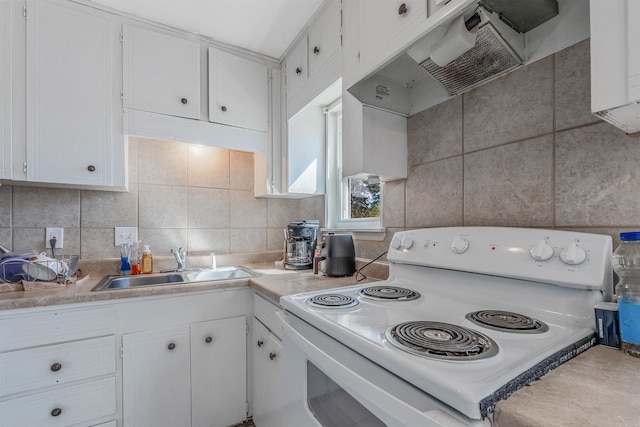 kitchen featuring white electric stove, light countertops, under cabinet range hood, white cabinetry, and a sink