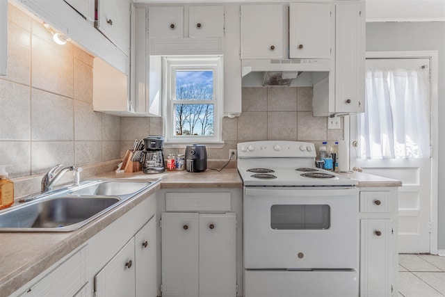 kitchen with white range with electric cooktop, white cabinets, decorative backsplash, under cabinet range hood, and a sink