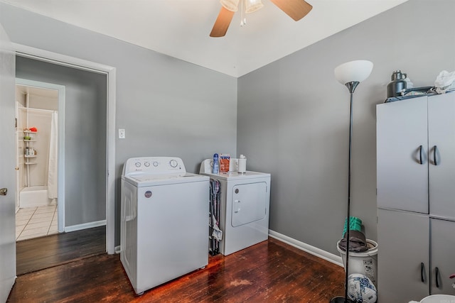 laundry room with washer and clothes dryer, cabinet space, a ceiling fan, wood finished floors, and baseboards