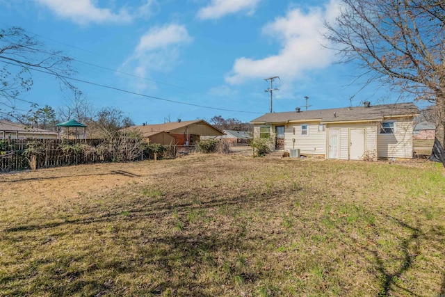 view of yard with fence and cooling unit