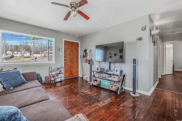 living area featuring wood-type flooring, ceiling fan, and baseboards