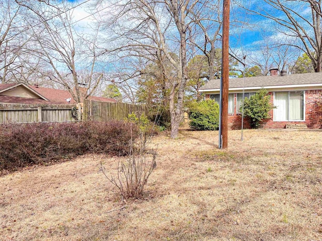 view of yard featuring fence