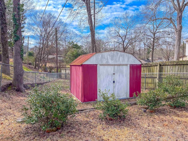 view of shed featuring a fenced backyard