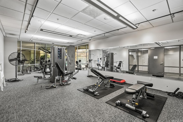 exercise room with a drop ceiling