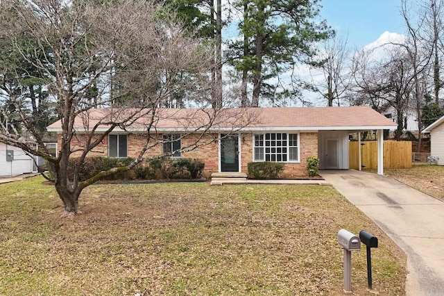 ranch-style home featuring fence, a front lawn, concrete driveway, and brick siding