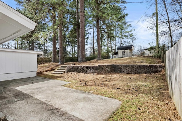 view of yard featuring a patio area and fence