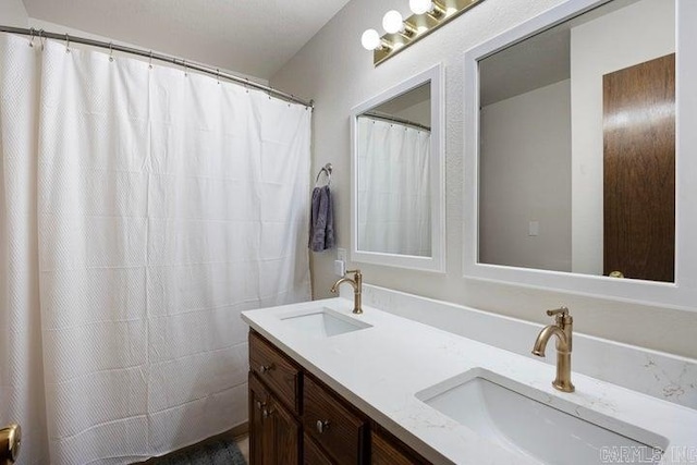 bathroom with double vanity and a sink