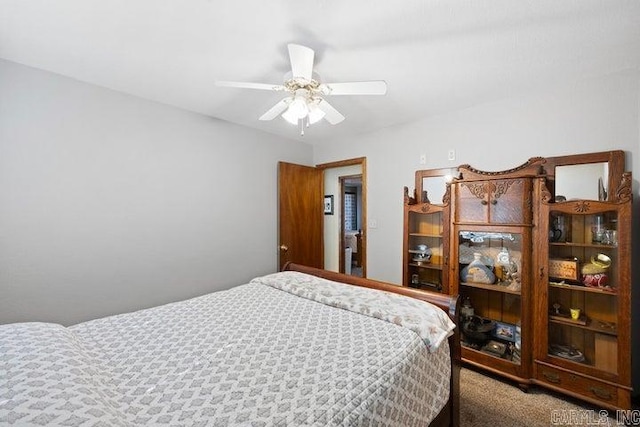 bedroom with a ceiling fan and carpet flooring