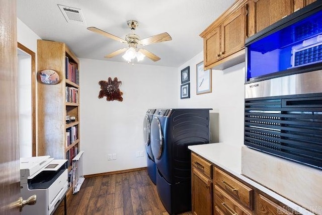 laundry room featuring laundry area, visible vents, washer and clothes dryer, ceiling fan, and dark wood-style flooring