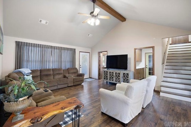 living room featuring dark wood-style flooring, beam ceiling, stairway, and visible vents