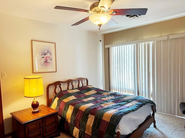 bedroom featuring a ceiling fan, carpet flooring, and visible vents