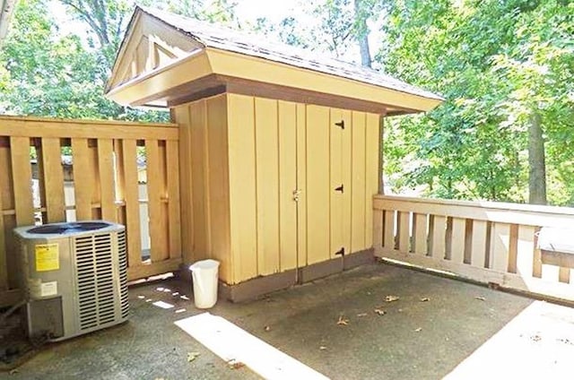 view of outbuilding featuring central air condition unit