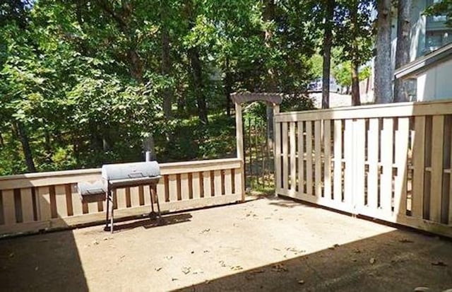 wooden deck featuring area for grilling